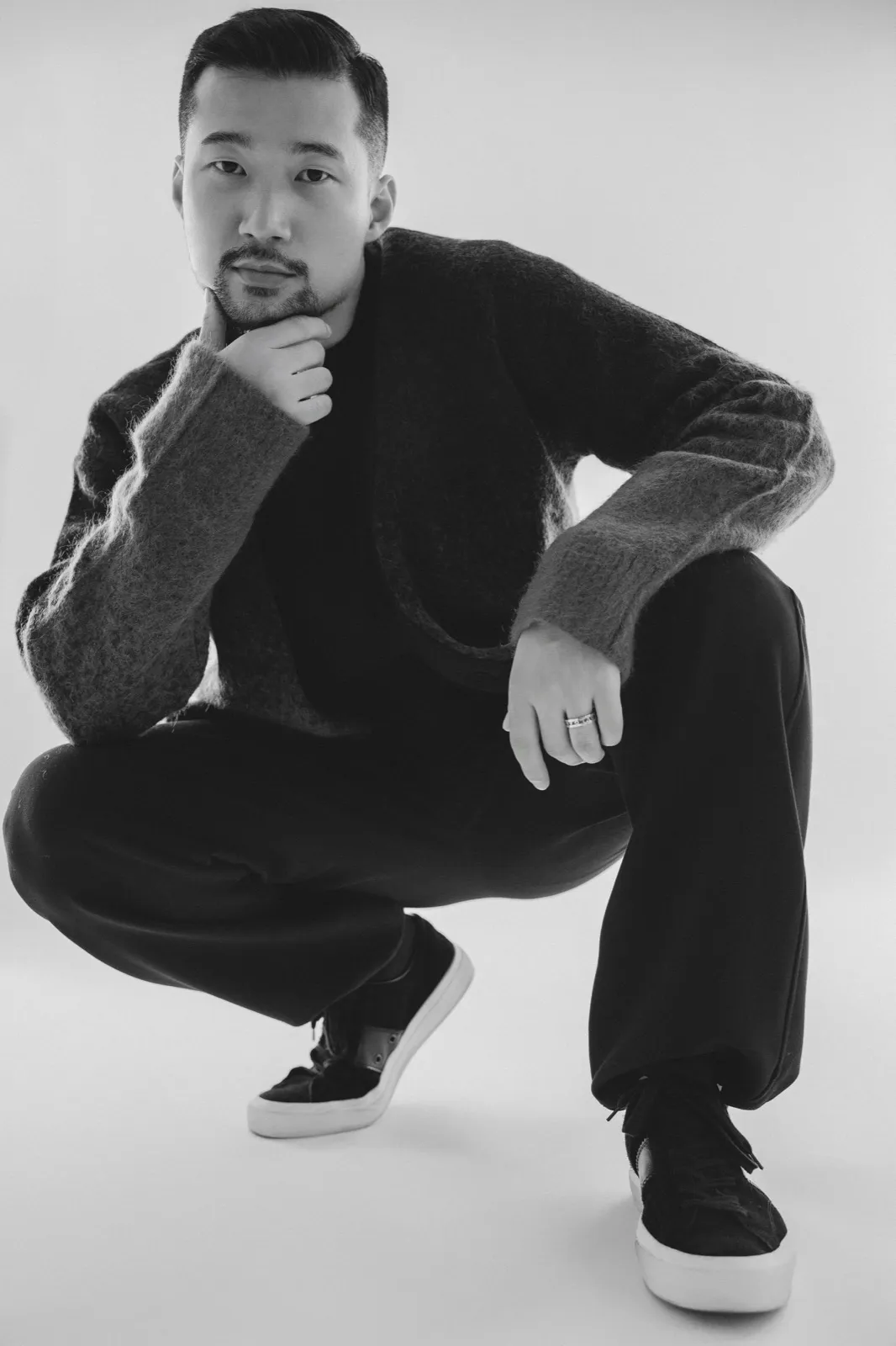 Crouching pose in black