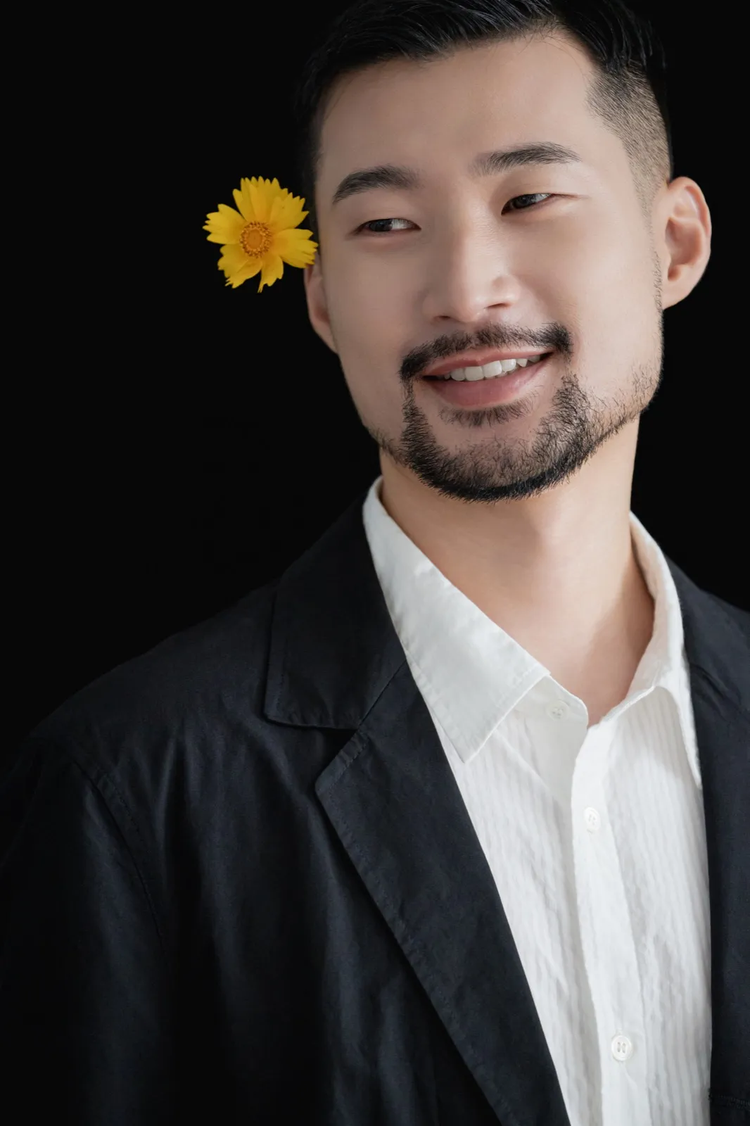 Side profile in sage suit