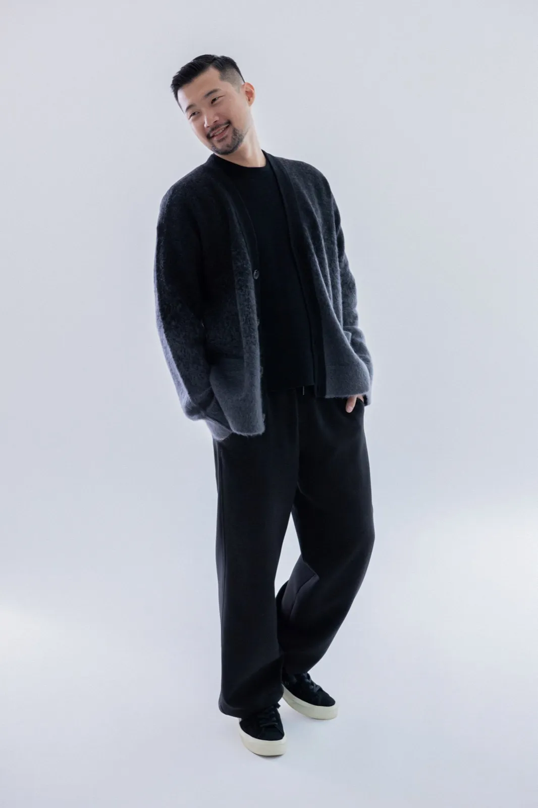 Standing in black cardigan