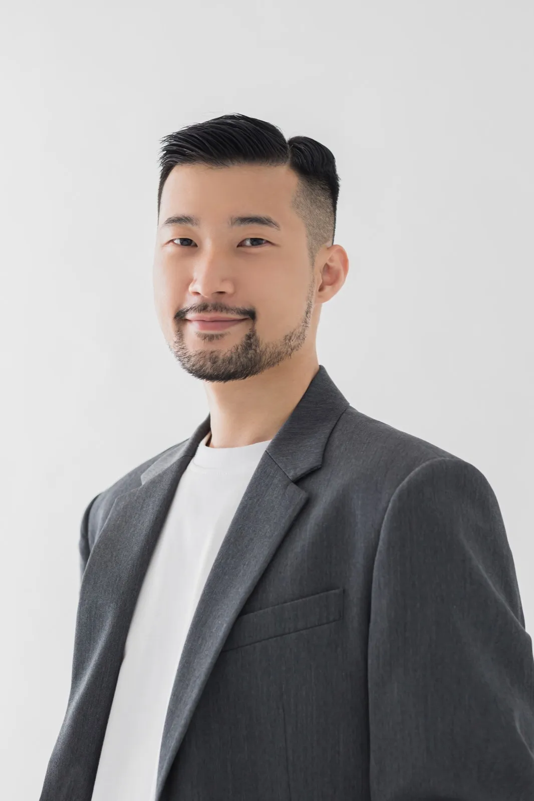 Seated on chair, smiling